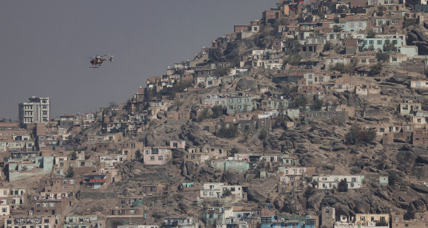 A military helicopter is pictured flying over Kabul, Afghanistan 