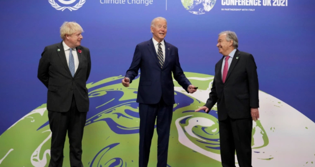 British Prime Minister Boris Johnson, left, and UN Secretary-General Antonio Guterres, right, greet US President Joe Biden , at the COP26 U.N. Climate Summit in Glasgow, Scotland, Monday, Nov. 1, 2021