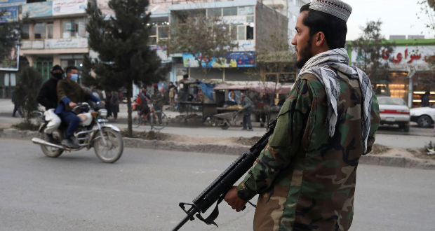 A Taliban fighter stands guard at the site of a blast in Kabul, Afghanistan, November 17, 2021. REUTERS/Ali Khara