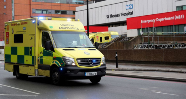 An ambulance drives past St Thomas' Hospital as the spread of the coronavirus disease (COVID-19) continues, in London, Britain, December 12, 2021. REUTERS/May James