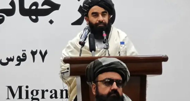 Taliban spokesman Zabihullah Mujahid speaks during a function to mark International Migrants Day in Kabul.(AFP)