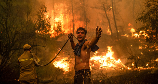 Forest fires swept through Greece in the summer as global temperatures continue to rise./Angelos Tzortinis/AFP