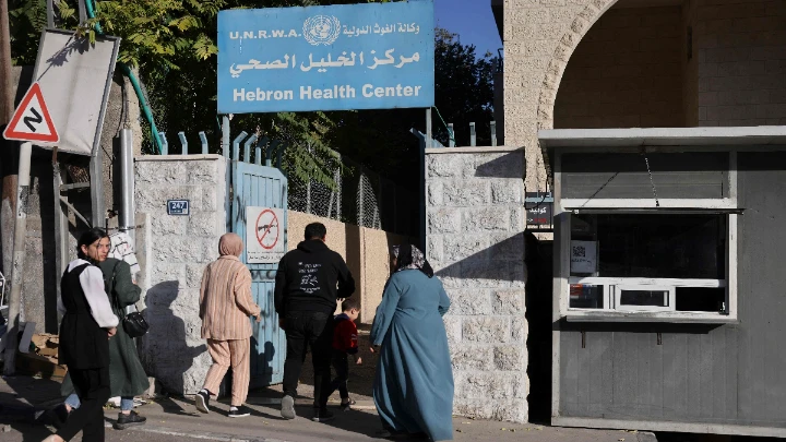 Palestinians enter the UNRWA (United Nations Relief and Works Agency) health centre, which provides free treatment, in the occupied West Bank city of Hebron on October 29, 2024. Photo: VCG