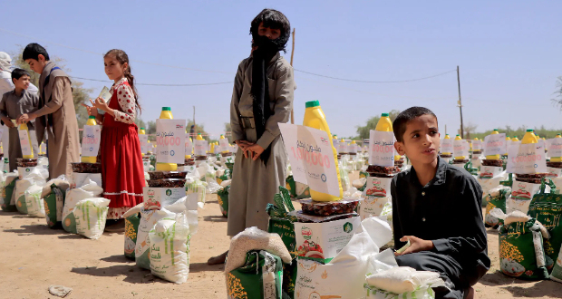Children collecting humanitarian aid provided by a Kuwaiti charitable organization this month on the outskirts of Marib, Yemen.Credit...Agence France-Presse — Getty Images