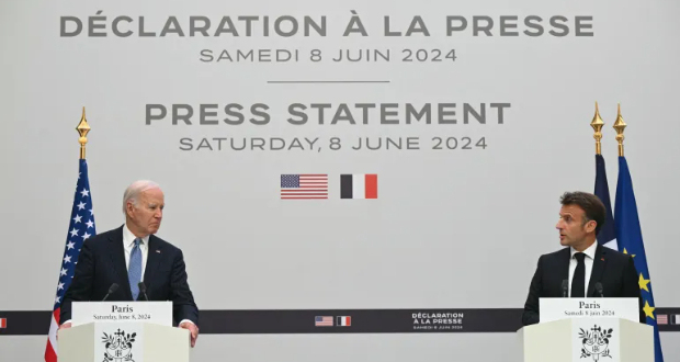 US President Joe Biden stands next to France's President Emmanuel Macron at the Presidential Elysee Palace in Paris [Saul Loeb/AFP]